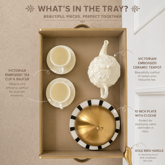 Flat lay of a beige butler tray with tea cups, teapot and serving cloche showcasing luxury breakfast serving essentials.