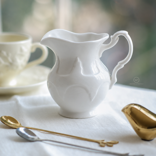 White ceramic serving jug for milk, cream and sauces