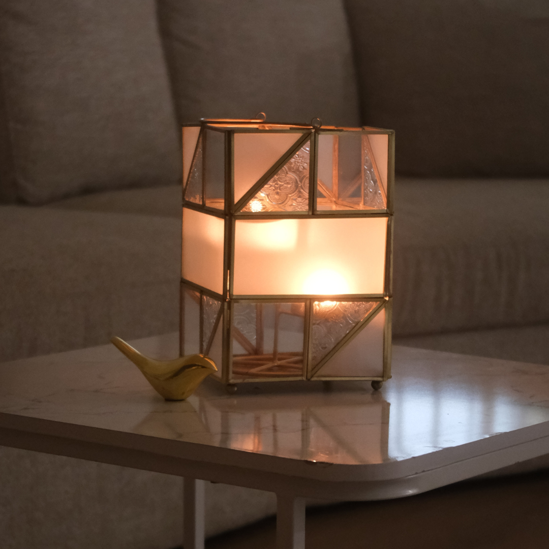 Frosted glass metal lantern ideal for home decoration and candlelight ambience.