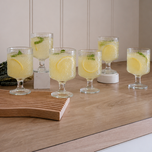 Lemonade Juice glasses placed on wooden kitchen counter