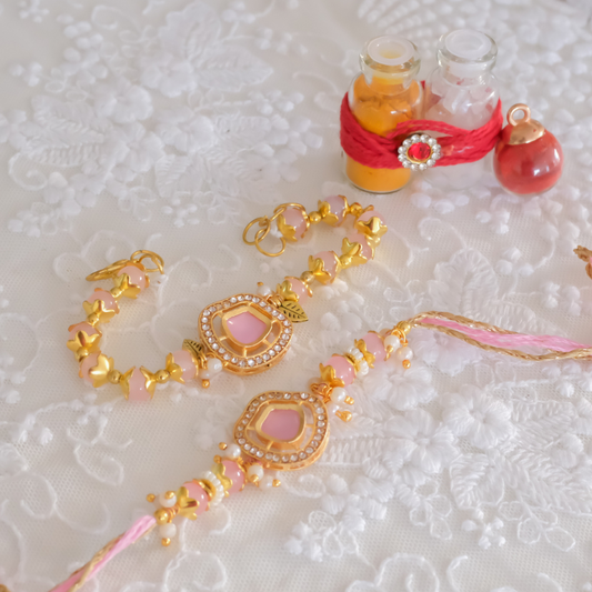 Luxury handcrafted pink crystal Rakhi set with matching Bhai and Lumba Rakhi, embellished with zircon stones, pearls and gold detailing.