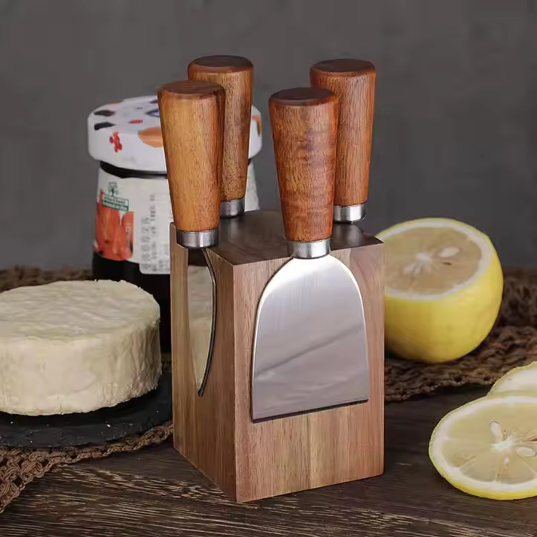 Silver cheese knives with wood handles on grazing board