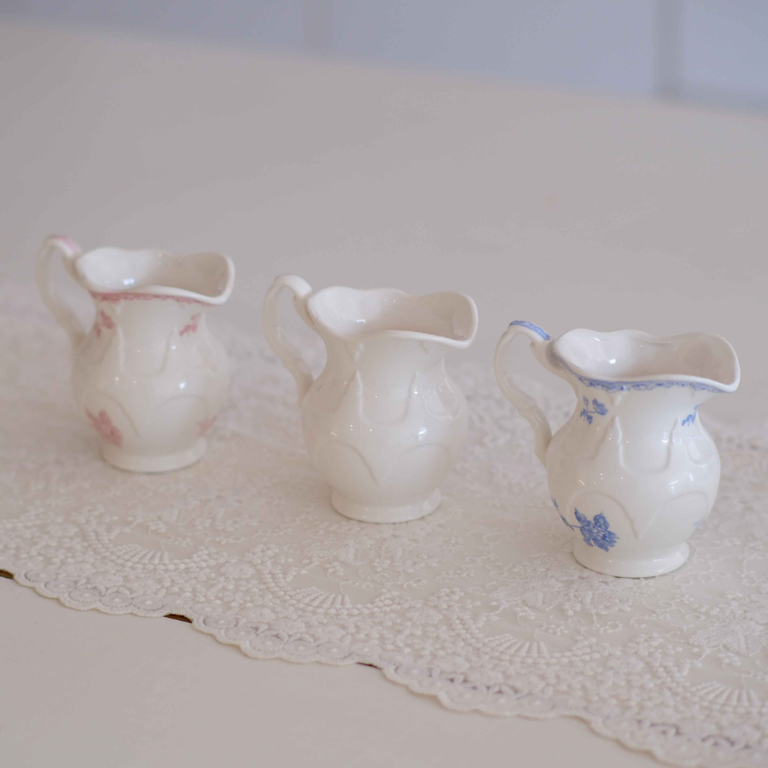 Premium Victorian ceramic milk creamer jug set featuring ivory, pink floral and blue floral designs, perfect for serving milk, cream and coffee at elegant tea parties.