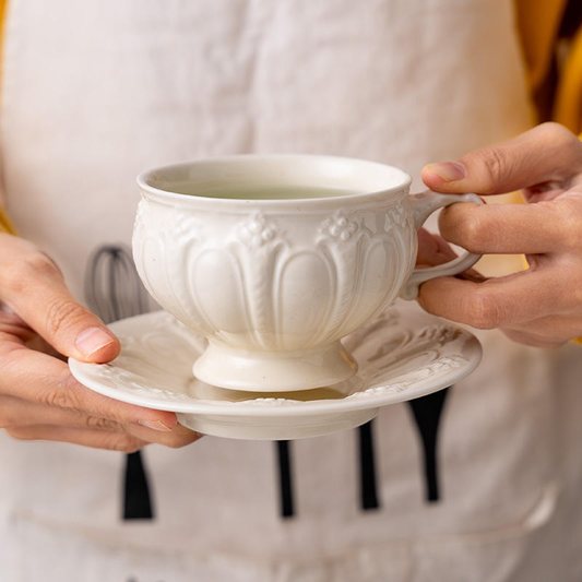 Victorian style ivory porcelain tea cup and saucer set for elegant high tea