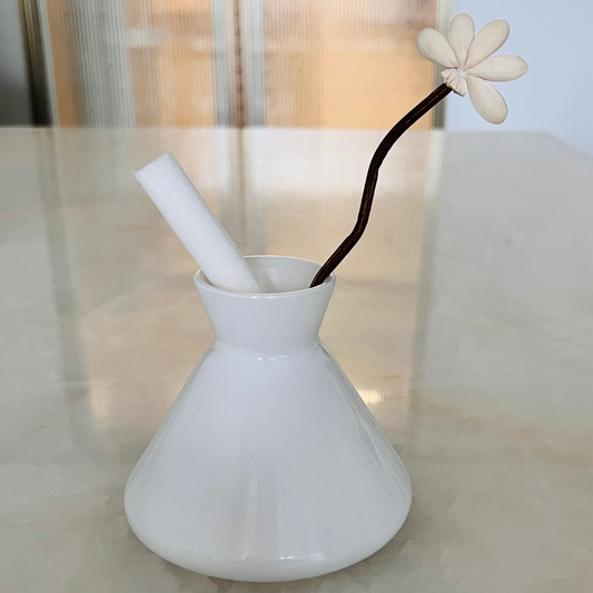 White conical vase with reed sticks – minimalist home decor