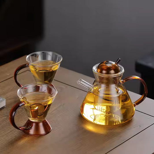 Elegant tea set on office desk – amber glass teapot