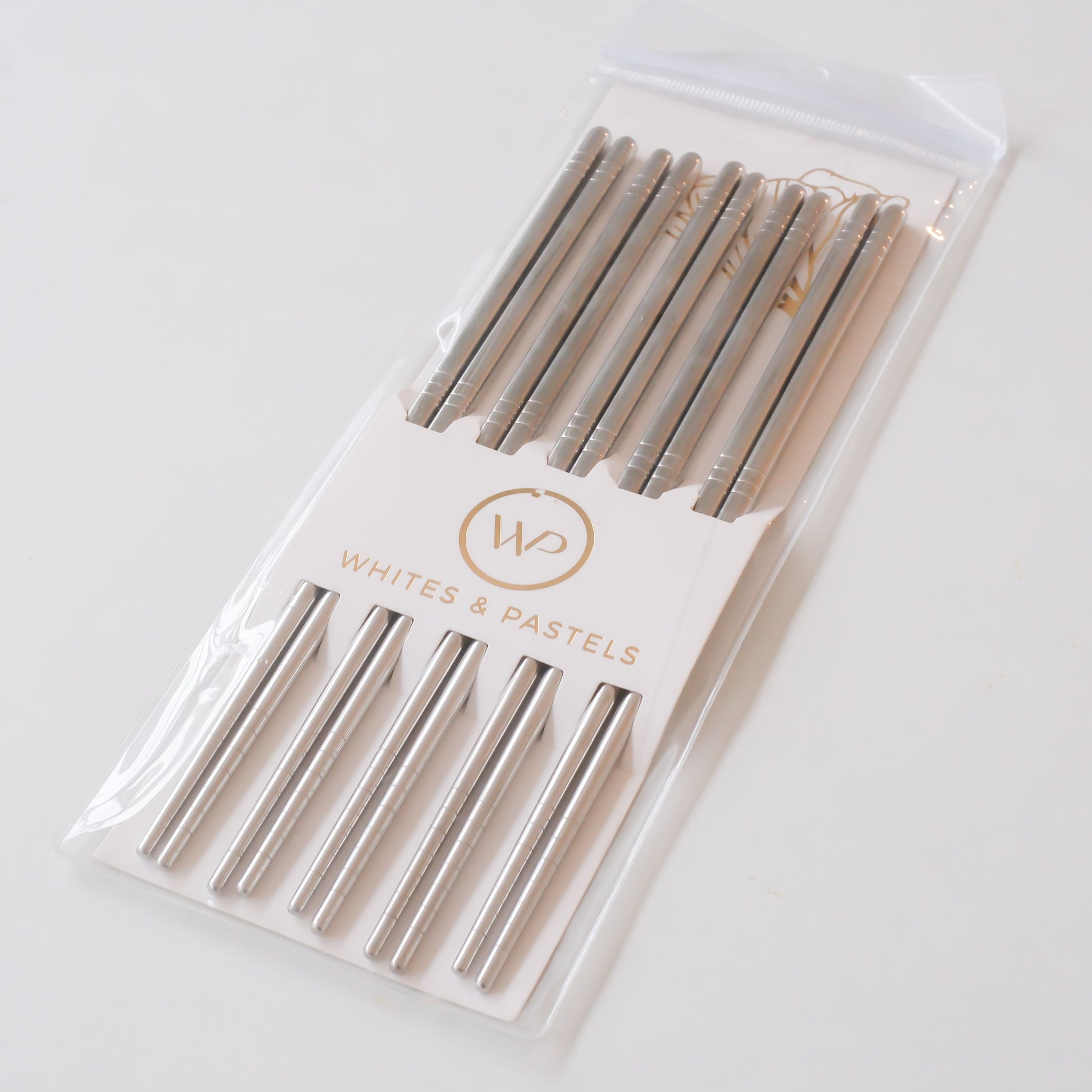 Packaged set of metal chopsticks. It is a 5 Pair Silver Chopstick set