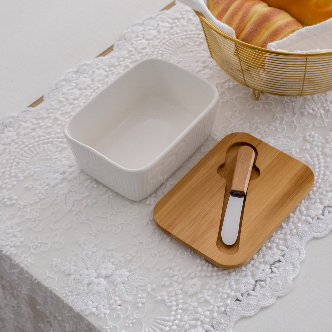 Ceramic butter dish featuring a thick bamboo lid