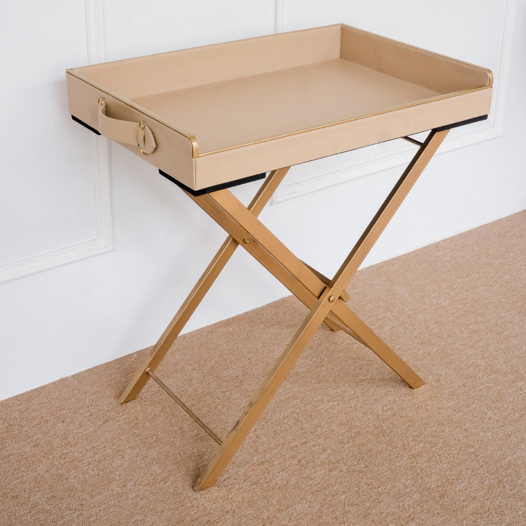 Side profile of a luxury beige butler tray featuring a decorative gold bird handle and premium folding stand.