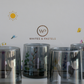 Six black drinking glasses arranged in front of a luxury Whites & Pastels gift box