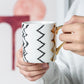 Black White Coffee Mug with gold handle and geometric print