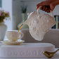 Ceramic teapot with  Butterfly embossed detailing and floral finial