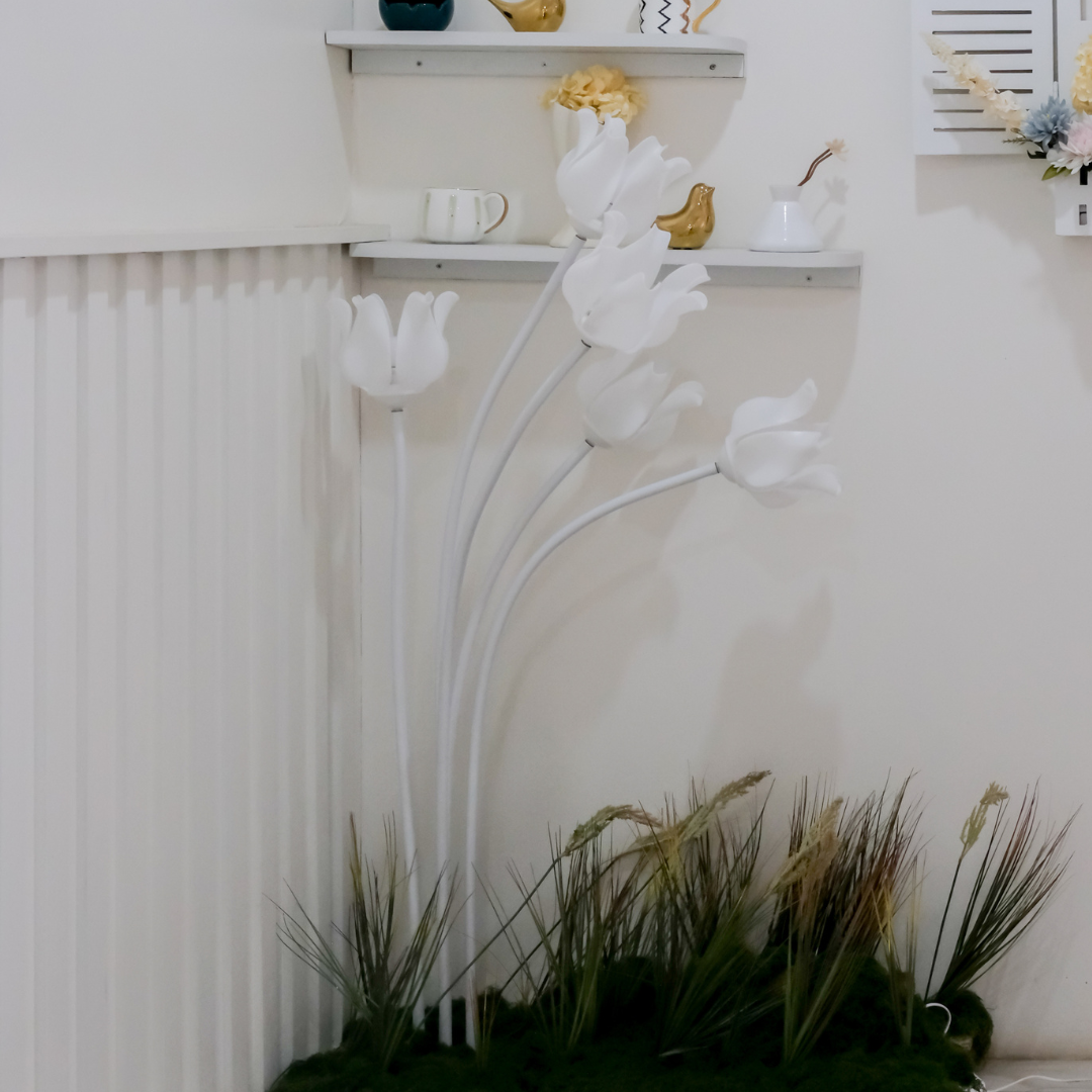 Lotus floor lamp placed in a garden setup