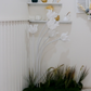 Lotus floor lamp placed in a garden setup