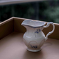 Blue floral porcelain milk jug with handle for tea and coffee serving