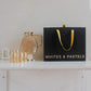 Brown borosilicate glass jug and four drinking glasses presented in a premium black gift box