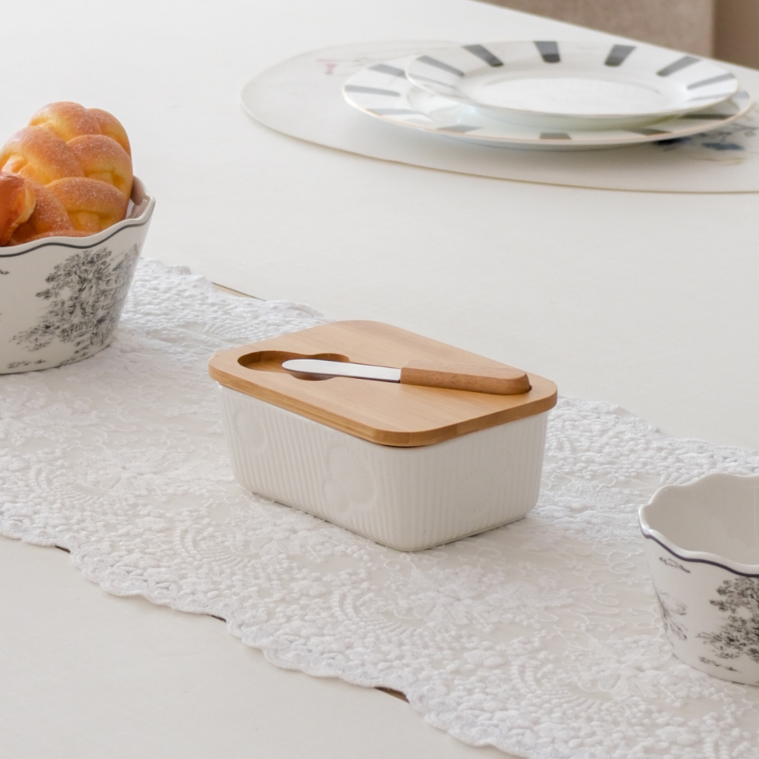 Butter dish placed on dining table for english breakfast