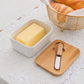 Breads placed on dining table with butter dish