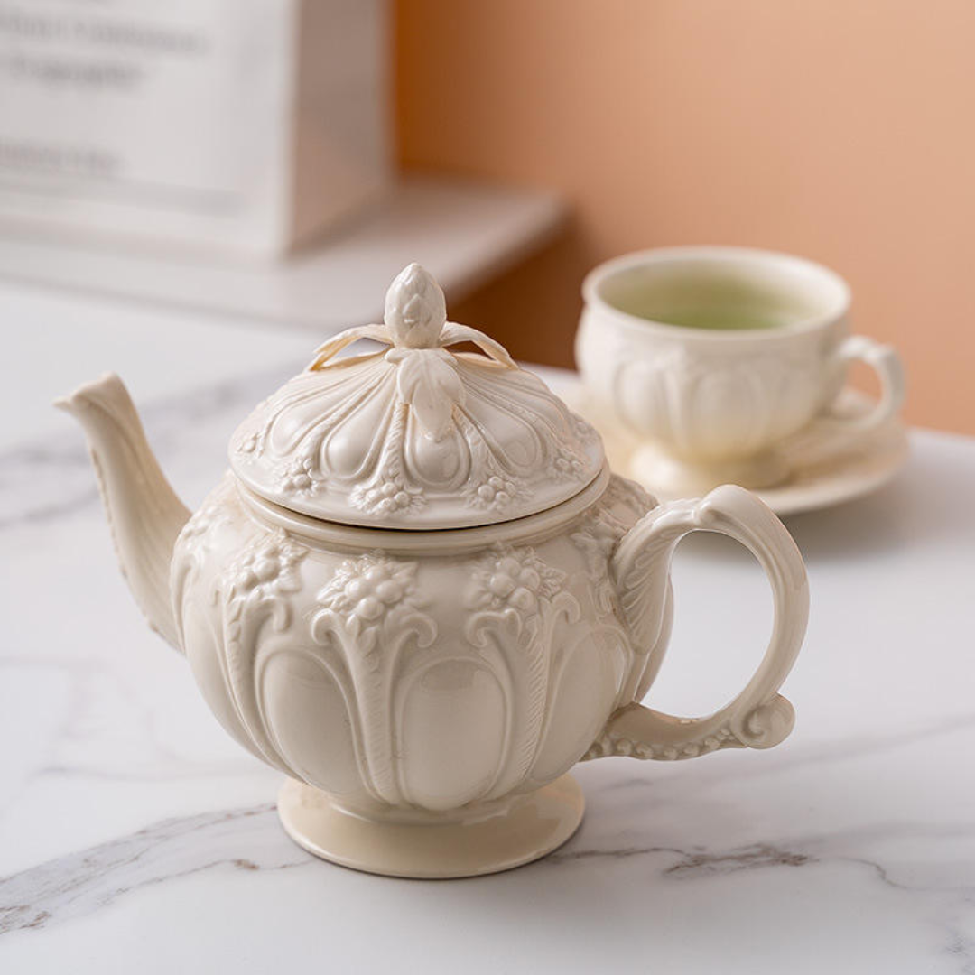Ceramic Teapot with tea cup and sauce embossed work