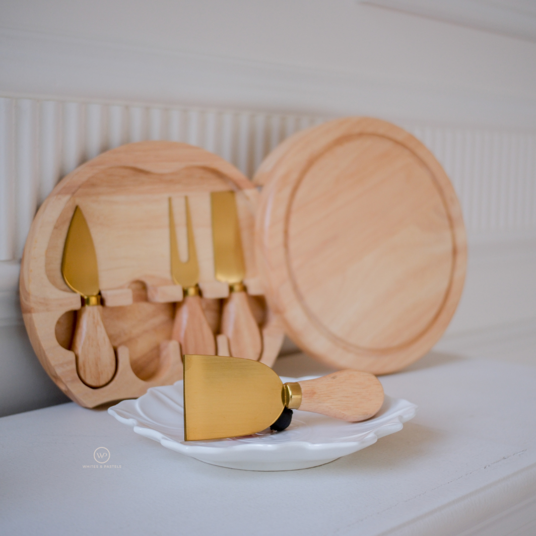 Premium round mango wood charcuterie board with stainless steel cheese serving knives.