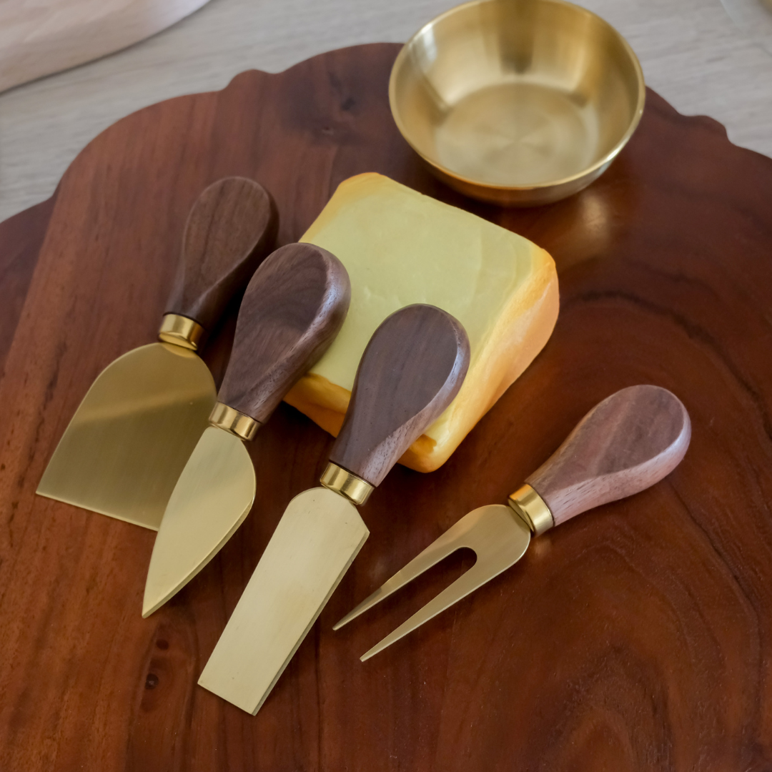 Elegant wooden cheese board gift set with four cheese knives and gold bowl