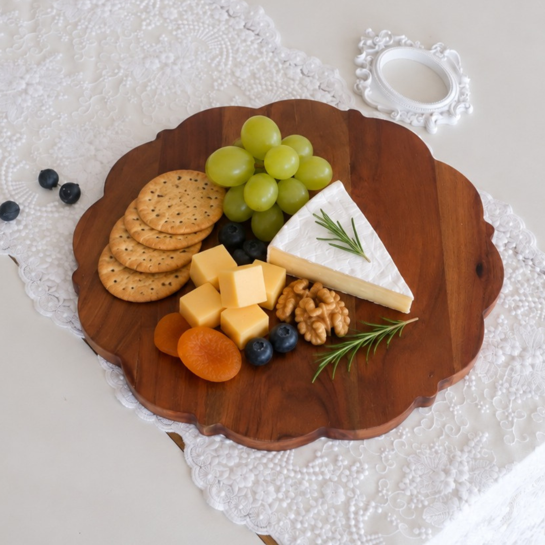 Natural wood cheese board with decorative scalloped edges.