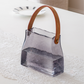 Stylish cocktail serving jar with leather strap for modern entertaining.
