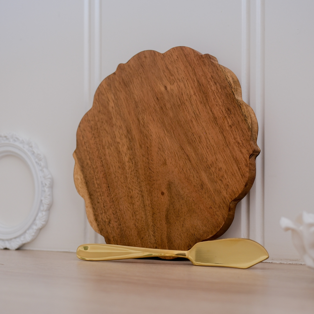 A mini charcuterie board placed against the wall with butter knife