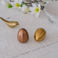 Premium dining décor salt and pepper shaker set with metallic finish.