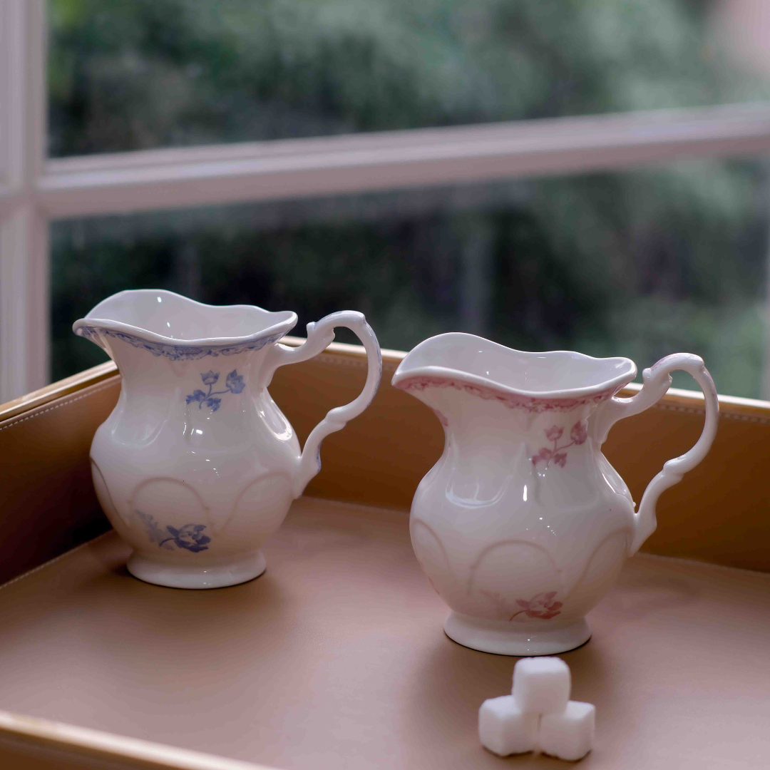 Compact 180 ml porcelain milk jug with floral detailing and handle