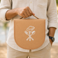 A man holding the cutlery bag with handle