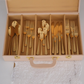 beige cutlery storage suitcase with handle for convenient carrying