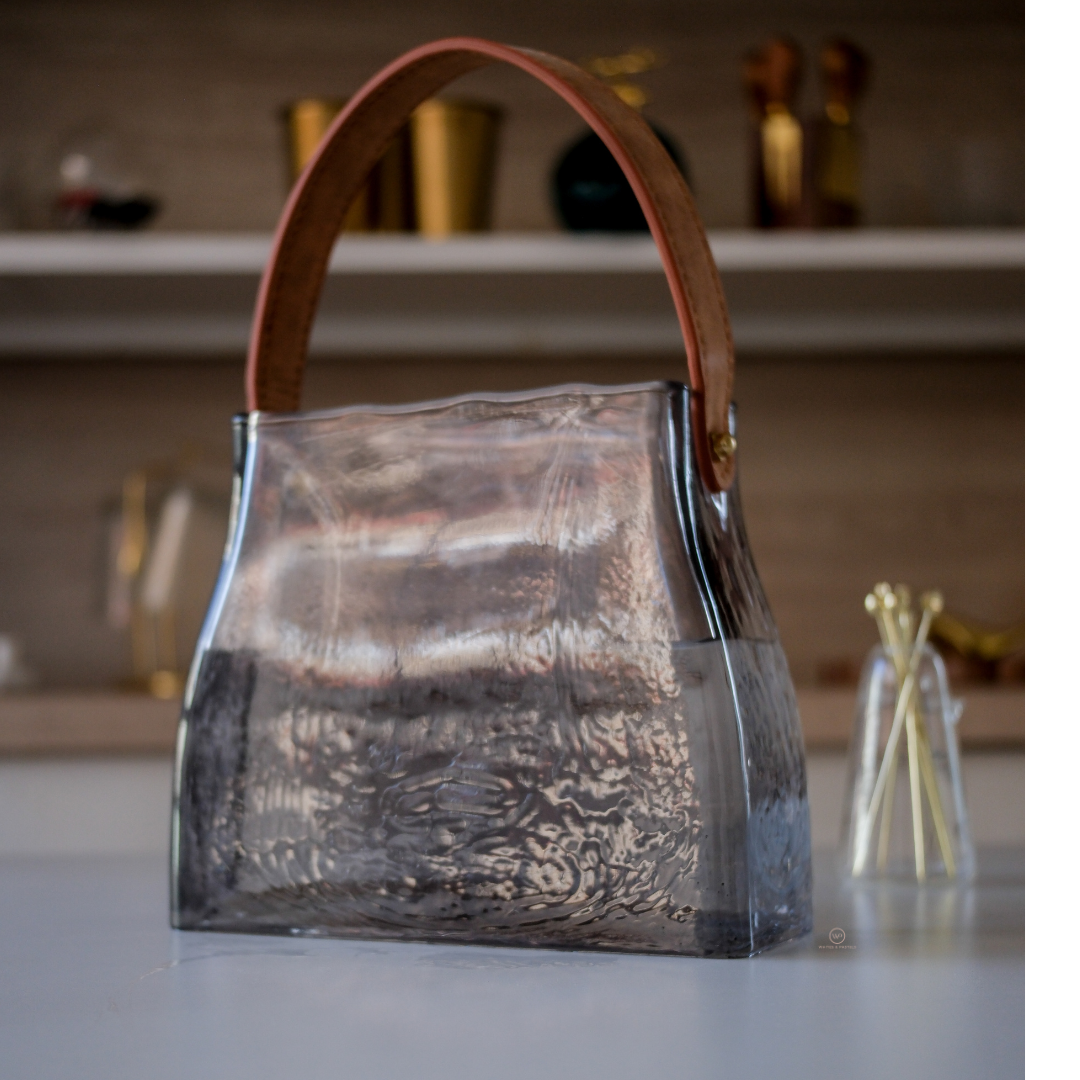 Modern transparent glass carafe with decorative handle