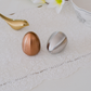 Modern rose gold and gold pepper shaker set for sophisticated dining.