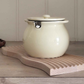 Elegant ceramic ghee storage container with pastel finish for modern kitchen décor.