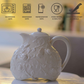 Embossed ceramic serving Tea pot with vintage floral detailing for modern dining tables