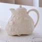 Decorative ivory ceramic tea pot with lid for serving tea