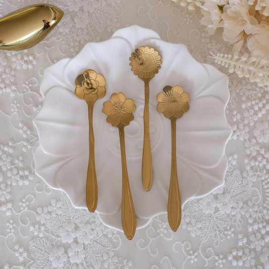 Modern gold flatware featuring detailed carved flower designs for elegant dining and gifting.