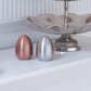 Modern egg-shaped salt and pepper shaker set in rose gold and matte gold Silver