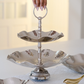 Contemporary two-tier serving platter with wavy edges and hammered detailing.