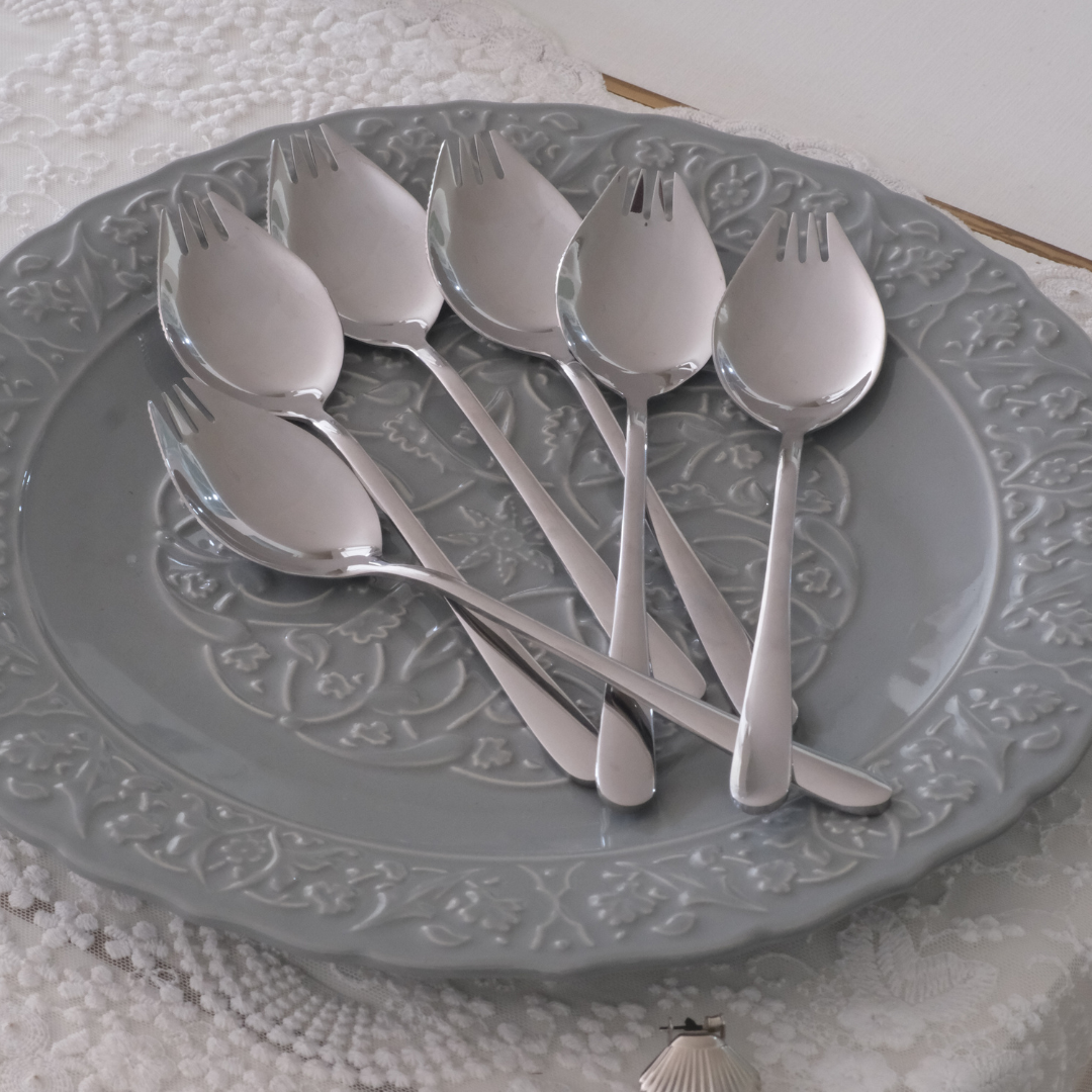 Premium Silver spork collection displayed on agrey textured plate