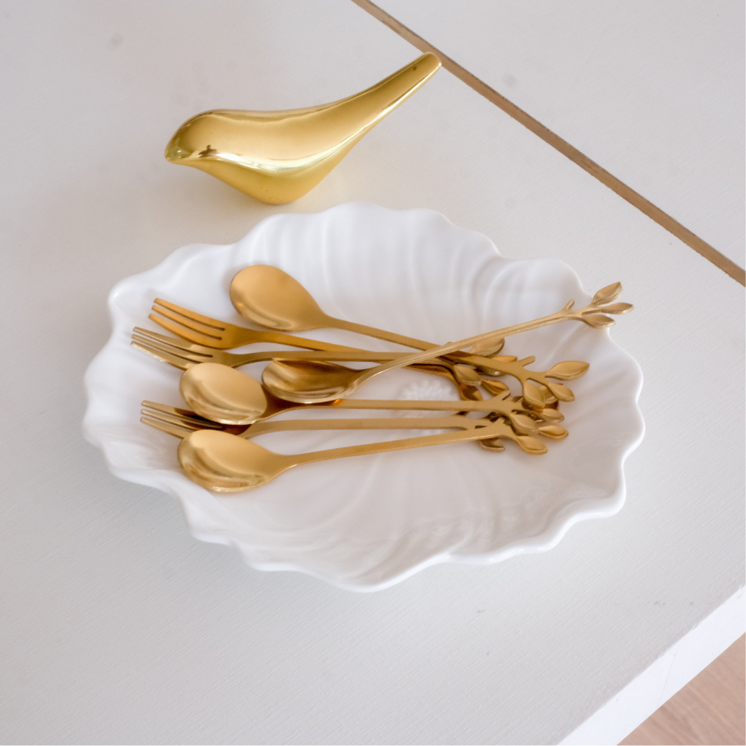 Luxury gold flatware fruit forks and tea spoons with sleek polished stainless steel finish