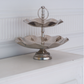 Designer metallic serving stand for entertaining guests and stylish food presentation.