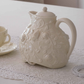 Premium ceramic teapot with embossed floral and butterfly detailing