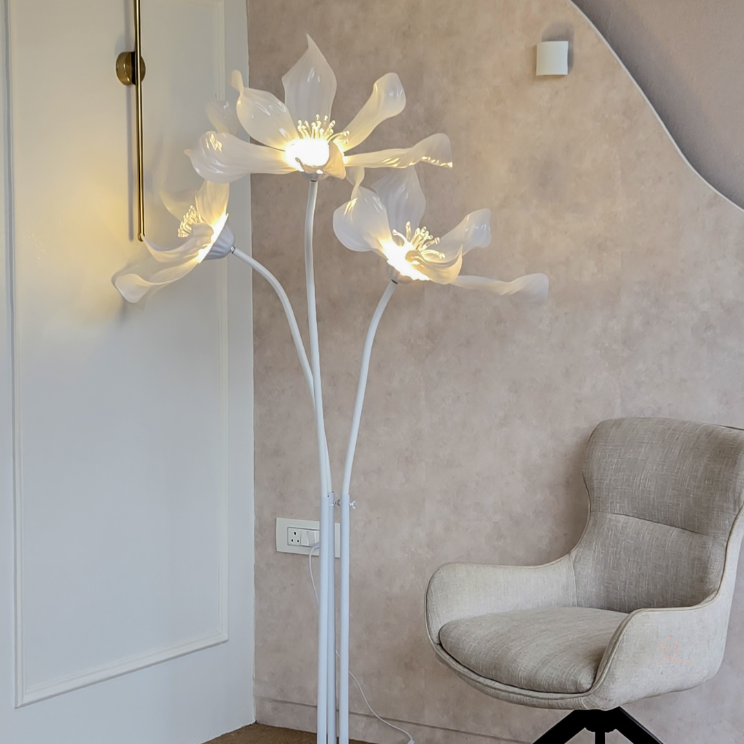 Elegant lily flower LED floor lamp with three sculpted floral lights.