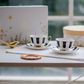 Black and white design cup with rosegold handle