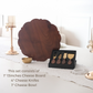 Cheese board placed on dining table with cheese knifes and serving bowl