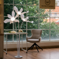 Modern floral standing floor lamp with warm ambient lighting.