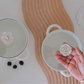 Minimalist white ceramic serving bowl with glass lid for everyday dining