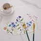 Tablemat placed on Dining table with tea cup and cutlery set
